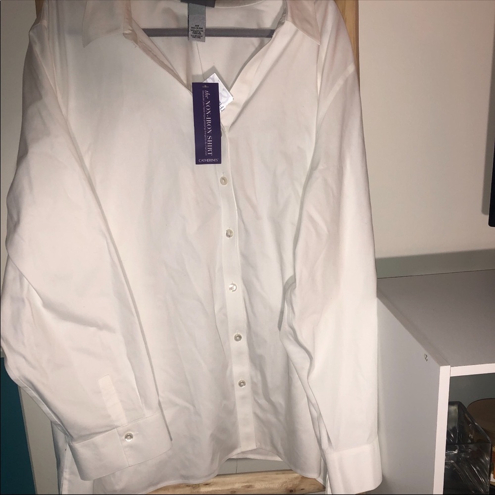 Catherine’s white button down long sleeved shirt